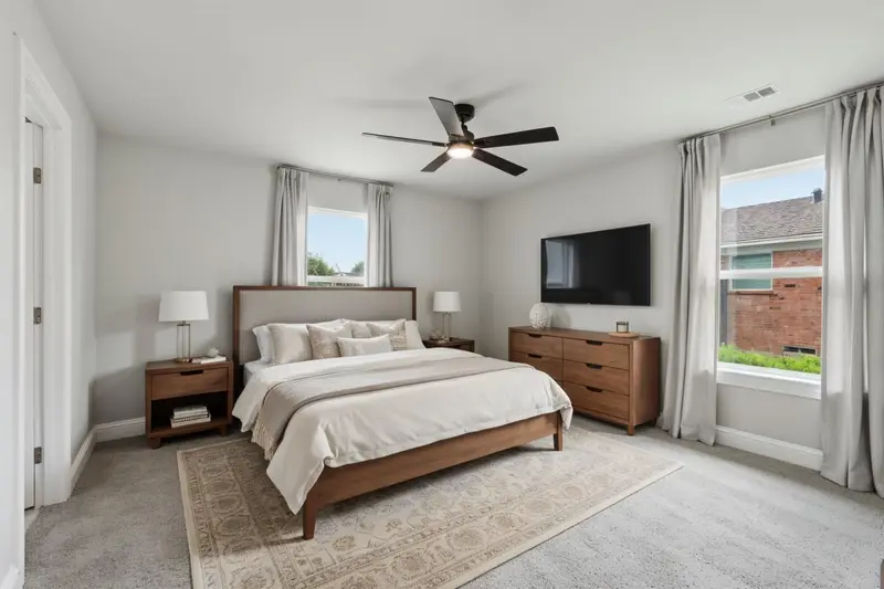 Virtually staged bedroom with a bed, nightstands and dresser
